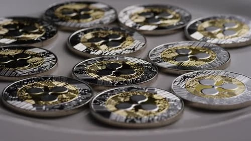 Ripple Coins on Gray Background Close Up