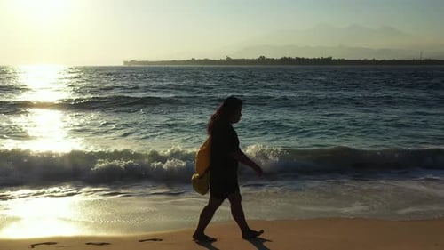 Beautiful happy lady on vacation enjoying life at the beach on summer white sandy and blue background