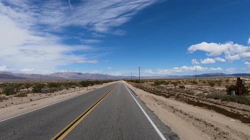 Driving Down the Endless Desert Road. Adventure Travel in a Desert.