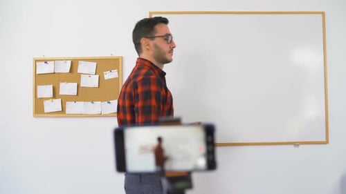 Man Giving Online Presentation to Smartphone Camera