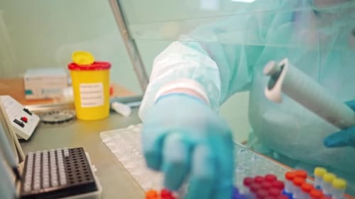 Medical Worker Testing Samples Inside Laboratory