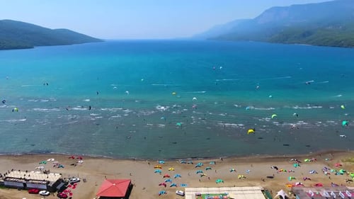 Kiteboarding, Kitesurfing Kiters and Kiteboarders are Pulled Across Sea Water by a Wind Power Kite