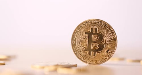 Golden Bitcoin Coin Falling in Slow Motion