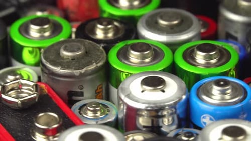 Close-up of many colorful household batteries