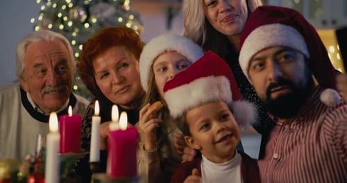 Smiling Family Celebrates Christmas Together at Home