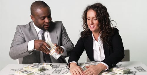 Business People Discussing Money at Table