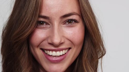 Woman Smiling Happily in Extreme Close-Up