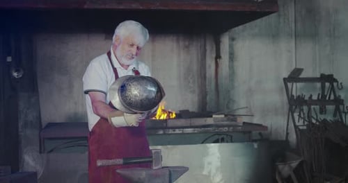 Blacksmith Working Fire in Furnplace Burning