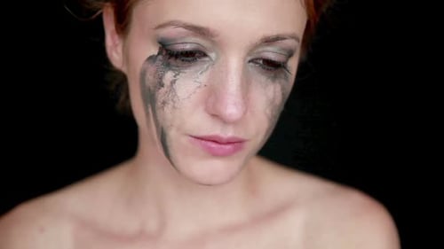 Sad Woman with Smeared Makeup Close Up