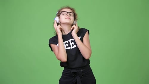 Young Adult with Headphones Listening to Music