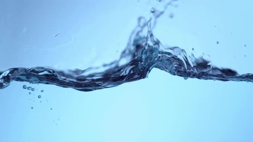 Water Wave Flowing Against a Serene Blue Background