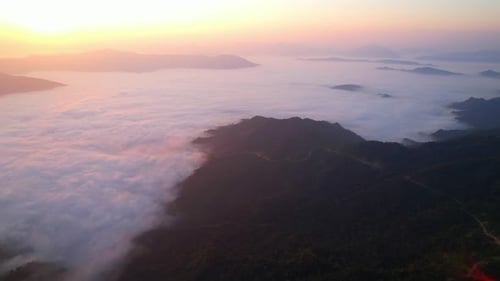 Aerial View of Mountains and Clouds at Sunrise