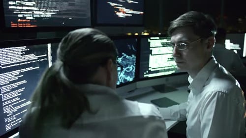 Colleagues Working in IT Office at Night