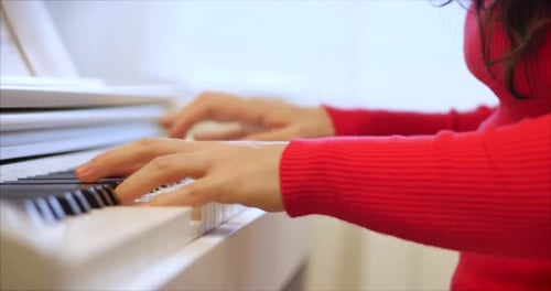 Woman Plays Piano Close Up Indoors