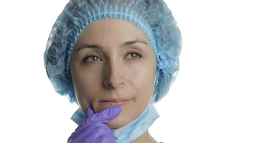 Young Doctor Is Thinking. Adult Female Medical Worker Searching a Right Solution
