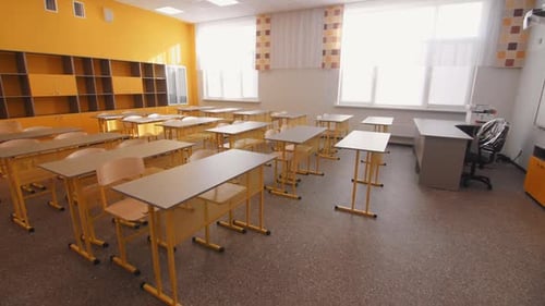 Empty Classroom with Desks and Whiteboard