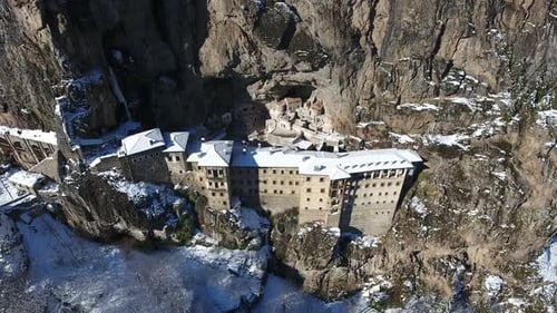 Monastery on the Steep Rock Wall in the Mountain