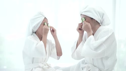 spa relaxation therapy at home, young Asian mother and her daughter enjoying with salon beauty