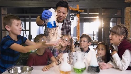 Excited Children Enjoying Science Experiment with Smoke