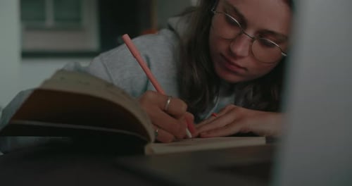 Millennial Woman at Home Work on Project or Study