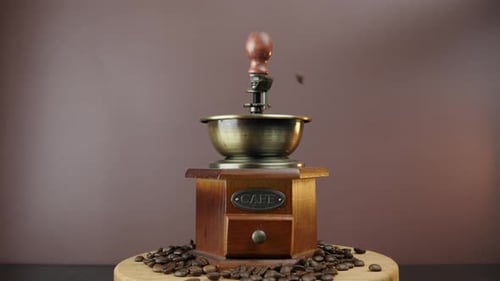 Coffee beans are falling into vintage coffee machine