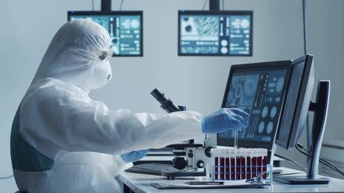 Scientist Analyzing Blood Samples in Bright Lab