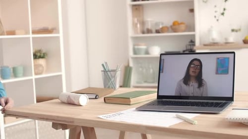 Girl at Laptop Participates in Online Learning