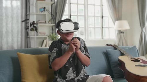 Young Adult Using VR Headset on Couch at Home