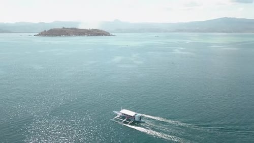 Aerial View of a Tourist Boat Sailing in the Blue Ocean.