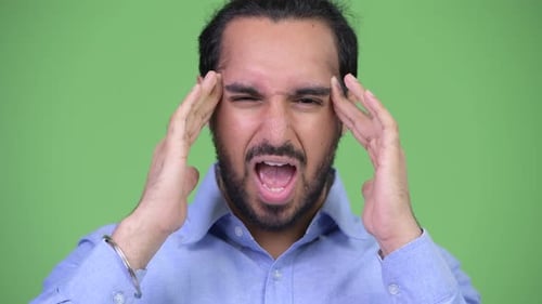 Adult Man with Headache Holding Temples Close Up