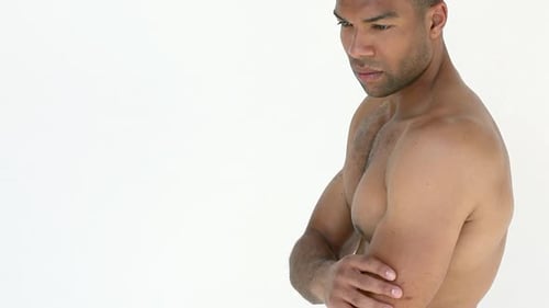 Man rubbing aching arm