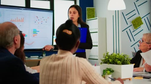 Business Team Discussing Data During Presentation