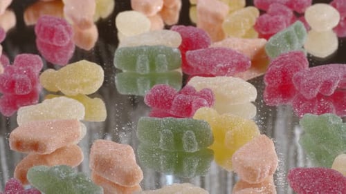 Assorted Gummy Bears on Reflective Surface Close Up