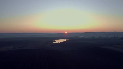 Sunrise On The Field. Earth Close Up. Bright Rays Illuminate The Earth