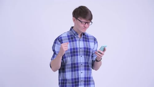 Young Man Using Smartphone Gives Thumbs Down