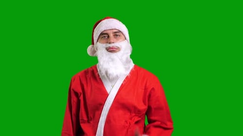 Santa Claus in Red Suit Showing Hand Palm on Green Chroma Key Background