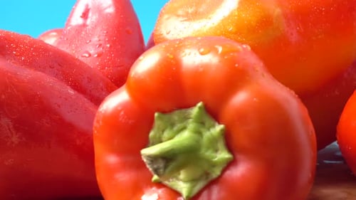 Close-up of Fresh Red Bell Peppers with Water Droplets