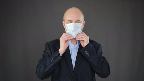 Adult Putting on a Medical Face Mask