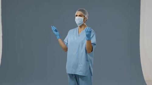Medical Professional in Scrubs, Mask, and Gloves