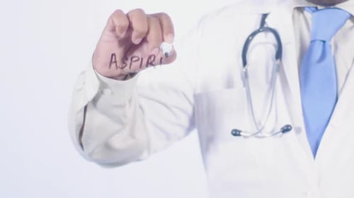Doctor Writes Aspirin on Transparent Surface