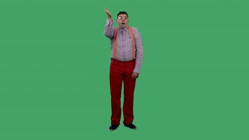 Confused Man on Green Screen Points Down