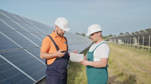 Chief Engineer and Specialists Learning the Report of Investment for Solar Plant