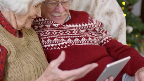 Senior Couple Using Tablet at Christmas Time