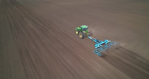Tractor on Agricultural Field Aerial View
