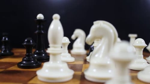 White And Black Figures On The Chessboard