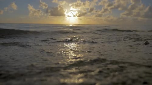 Sea Waves on the Shore at Sunset