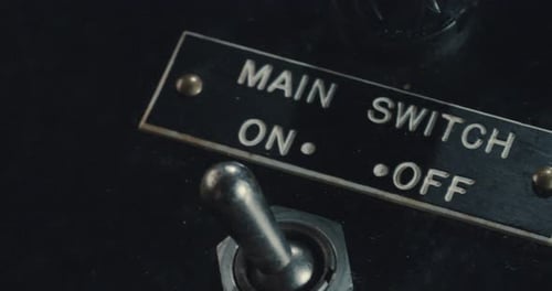 Finger Turns Metal Switch from On to Off