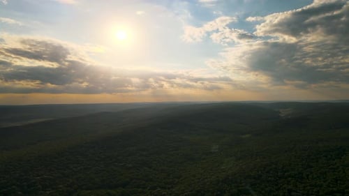HDR Aerial View the Drone's Flight Over the Rainforest with a Formidable Sunset