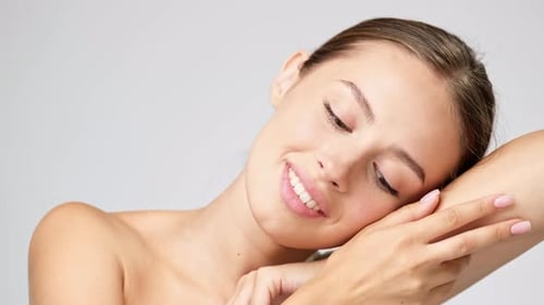 Young Woman Posing With Flawless Skin and Smile