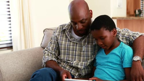 Adult and Child with Tablet Indoors